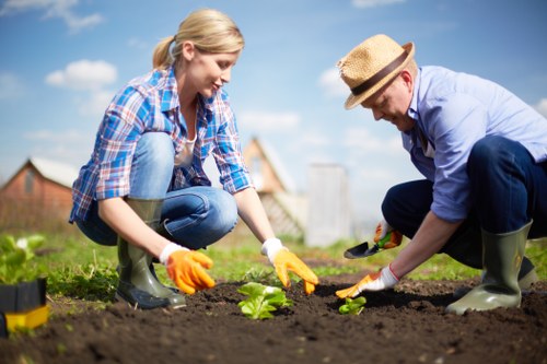 Trainer delivering safety instruction to gardening team